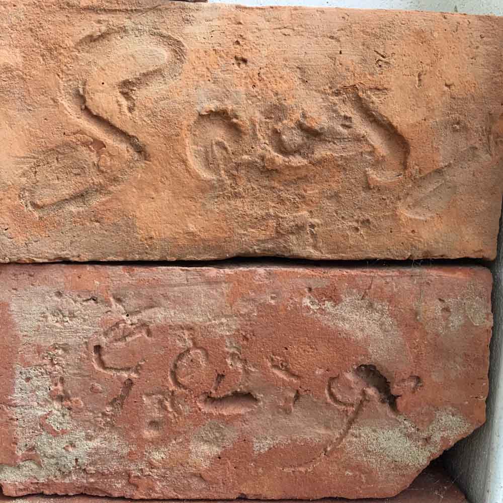 Scratching names and initials into bricks was commonplace in the days when Sydney was first built.